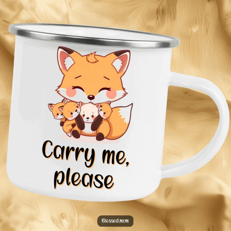 Funny Mama Fox camping mug depicts a cute fox carrying its kits playfully in its mouth, designed for outdoor enjoyment.