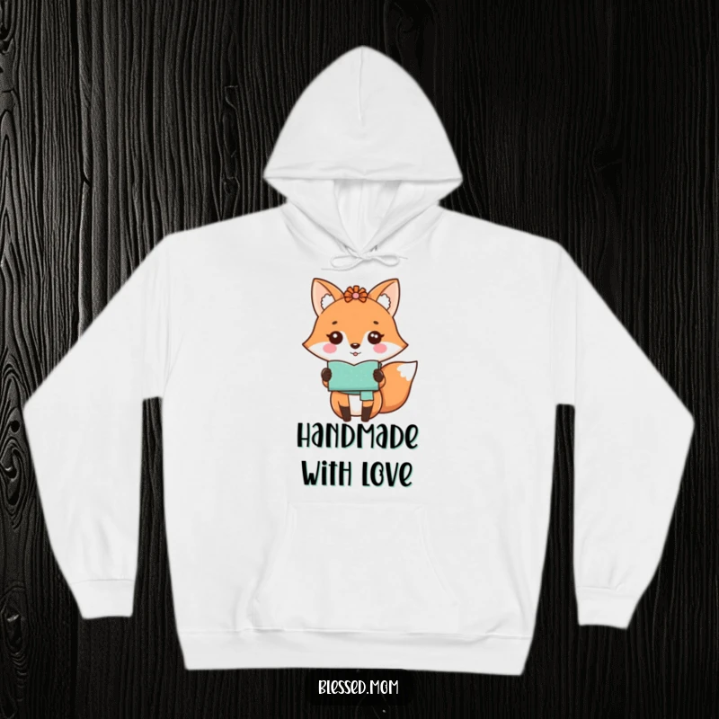 Funny kawaii fox mom proudly showing a handmade craft on a cozy hoodie, a comforting gift.
