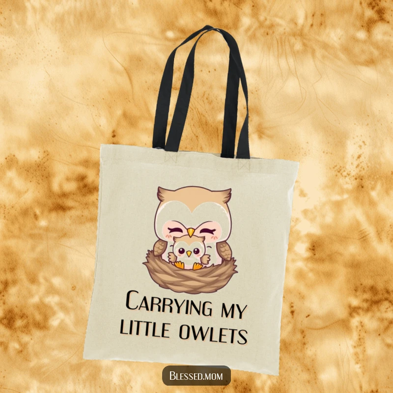 Funny tote bag featuring a mother owl tucking her baby owl into a nest, showcasing maternal care and cuteness.